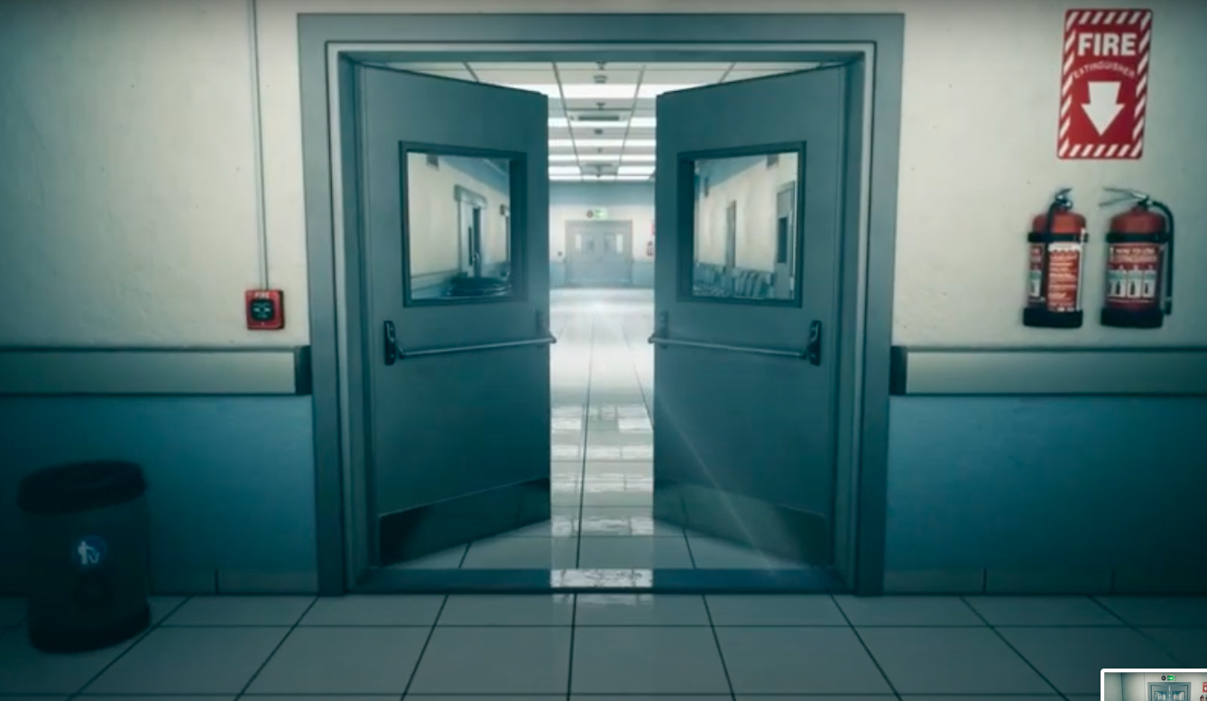 A shot from the music video, white walls with two blue hospital doors opening and a fire extinguisher on the right wall.